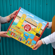 Load image into Gallery viewer, High Quality mailer box with a beautifully illustrated scene of Granville Island, Giants Mural, Burrard Bridge, and Vancouver skyline on the gift box