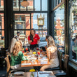 Load image into Gallery viewer, Vancouver Foodie Tours guests sharing a tasting with their guide
