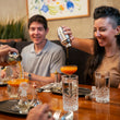 Load image into Gallery viewer, Guests on a guided Vancouver Foodie Tour
