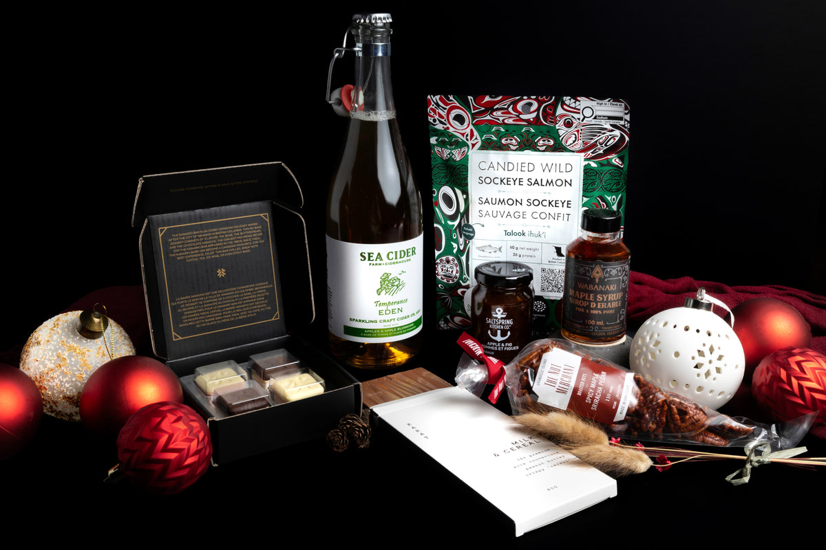 Holiday display of Canadian-made treats including sparkling cider, candied salmon, maple syrup and chocolate