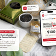 Load image into Gallery viewer, Digital Granville Island Delivery Co. gift card shown in an email on a phone, on a linen table with local gifts
