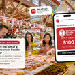 Load image into Gallery viewer, Digital Vancouver Foodie Tours gift card shown in an email on a phone, in front of guests at Lee's Donuts in the Granville Island Public Market
