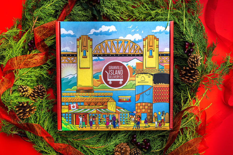  High Quality mailer box with a beautifully illustrated scene of Granville Island, Giants Mural, Burrard Bridge, and Vancouver skyline on the gift box in a circle of Christmas decor.