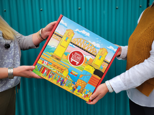 High Quality mailer box with a beautifully illustrated scene of Granville Island, Giants Mural, Burrard Bridge, and Vancouver skyline on the gift box
